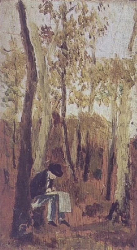 Uomo seduto che scrive nel bosco